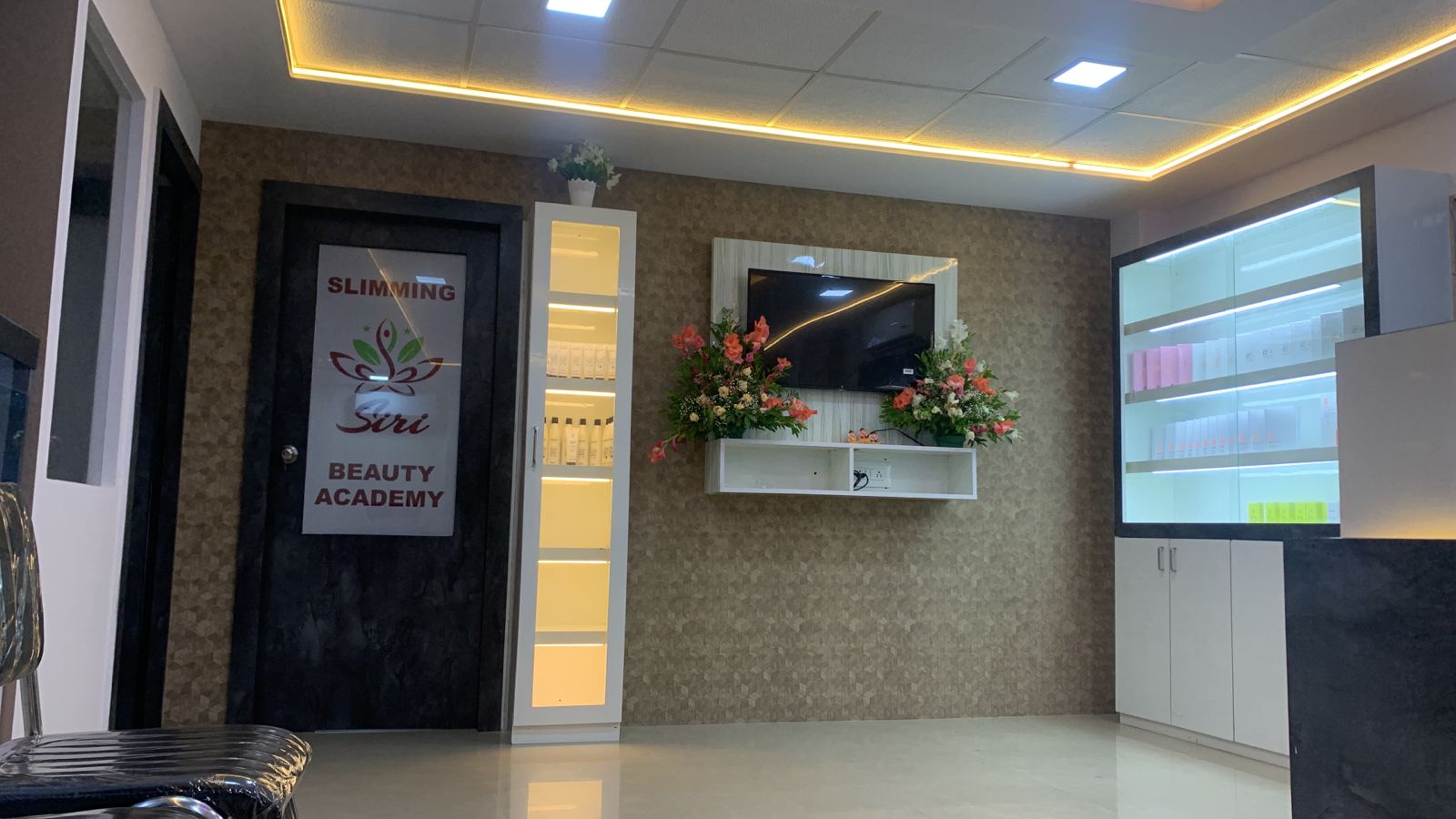 Interior view with product displays and beauty academy entrance